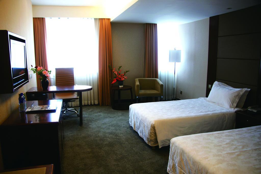 New Gloria Plaza Garden Hotel Харбін Номер фото