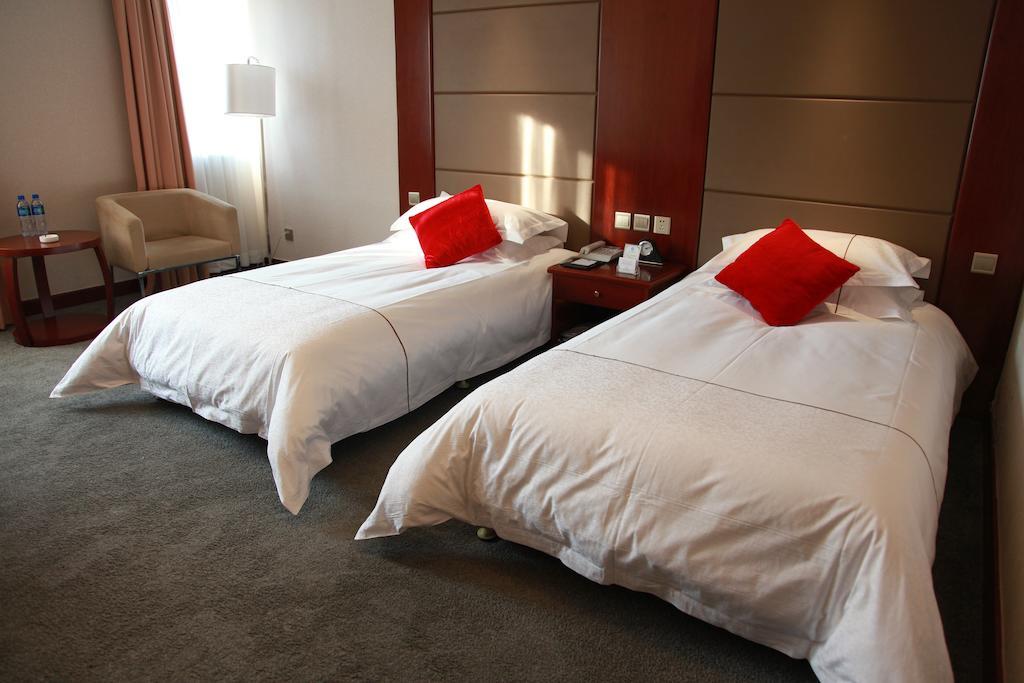 New Gloria Plaza Garden Hotel Харбін Номер фото